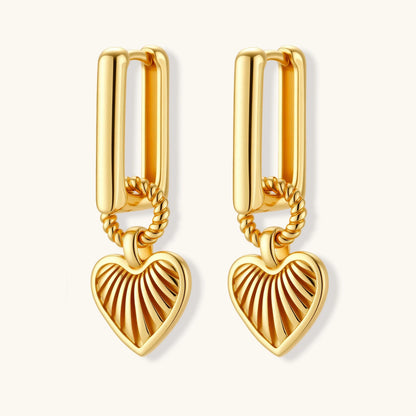 18K gold-plated rectangular huggie hoops with twisted rope ring and ribbed sunray heart charm pendant, on white background.